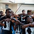 Xolani Zingeni (centre) is one of dozens of youngsters from South Africa to study an instrument at Buskaid, a school specifically for black township children