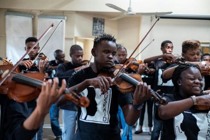 Xolani Zingeni (centre) is one of dozens of youngsters from South Africa to study an instrument at Buskaid, a school specifically for black township children