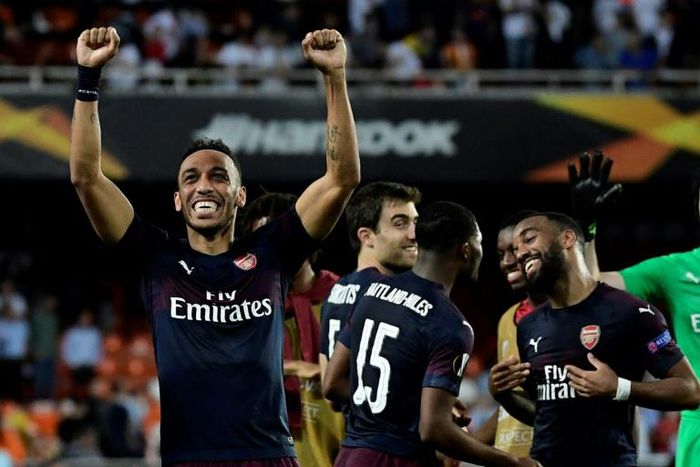 Three of the best: Pierre-Emerick Aubameyang celebrates victory