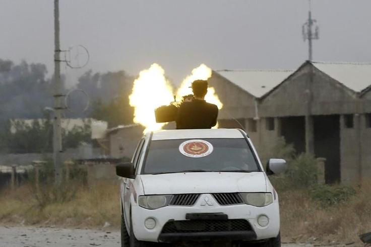 Fighters loyal to the Libyan internationally-recognised Government of National Accord fire a heavy machinegun during clashes against forces loyal to strongman Khalifa Haftar, on May 21, 2019 in the Salaheddin area south of the Libyan capital Tripoli
