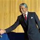 Nelson Mandela became the country's first black president taking over from FW de Klerk (L)