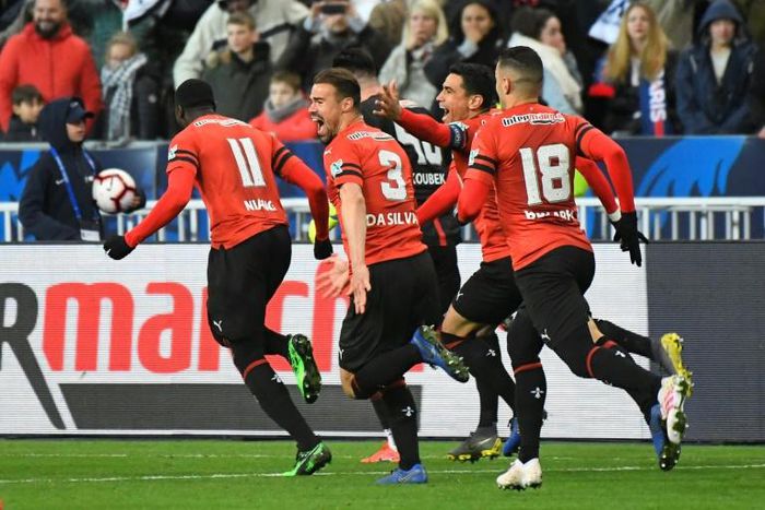 Rennes players celebrate after winning the French Cup final on penalties against PSG