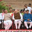 Narendra Modi (L) sits next to BJP President Amit Shah (2R) and Minister of Home Affairs of India Rajnath Singh (2L) before Modi's swearing-in ceremony as Indian Prime Minister at the President house in New Delhi on May 30, 2019