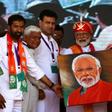 Indian Prime Minister Narendra Modi (C) holds a canvas displaying a portrait of himself during an election rally in Chittorgarh, in the western state of Rajasthan -- Modi will vote in his home state of Gujarat on "Super Tuesday"