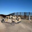 Mexican soldiers drive along a section of the US-Mexico border fence in Sonoyta, Mexico on February 16, 2017
