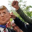 Iranians protest using a mask depicting US President Donald Trump during a rally in Tehran on May 19, 2019