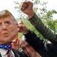 Iranians protest using a mask depicting US President Donald Trump during a rally in Tehran on May 19, 2019