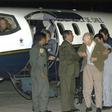 The sect's founder Paul Schaefer (centre), seen in March 2005, is helped aboard a Chilean Air Force Plane in Buenos Aires after being expelled from Argentina to Chile, where he died in jail