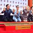 The cast of "The Big Bang Theory" press their handprints into the cement at the TCL Chinese Theatre