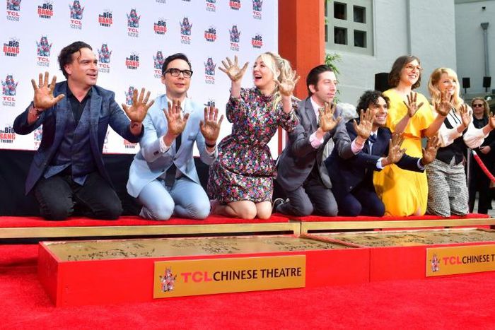 The cast of "The Big Bang Theory" press their handprints into the cement at the TCL Chinese Theatre