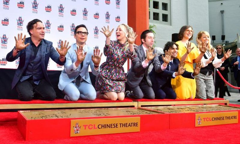 The cast of "The Big Bang Theory" press their handprints into the cement at the TCL Chinese Theatre