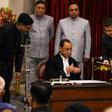 Chief Justice (seated) has been cleared by an in-house Supreme Court panel of sexual harassment