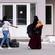The 26 women placed under house arrest are among a group of around 30 flown back to Pristina alongside 74 children and four men