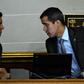 In this file photo taken on March 06, 2019, Venezuelan opposition leader and self-proclaimed acting president Juan Guaido (R) speaks with Venezuelan National Assembly's first vice-president Edgar Zambrano during a session in Caracas