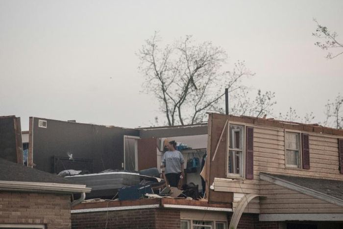 Trotwood, Ohio residents inspect damage to their homes following powerful tornados on May 28