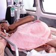 A woman injured in the St Sebastian Church blast is taken to hospital