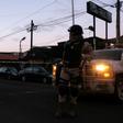 Mexican soldiers guard a crime scene where a man was killed by gunfire in downtown Tijuana, one of many cities riven by drug cartel violence in the country