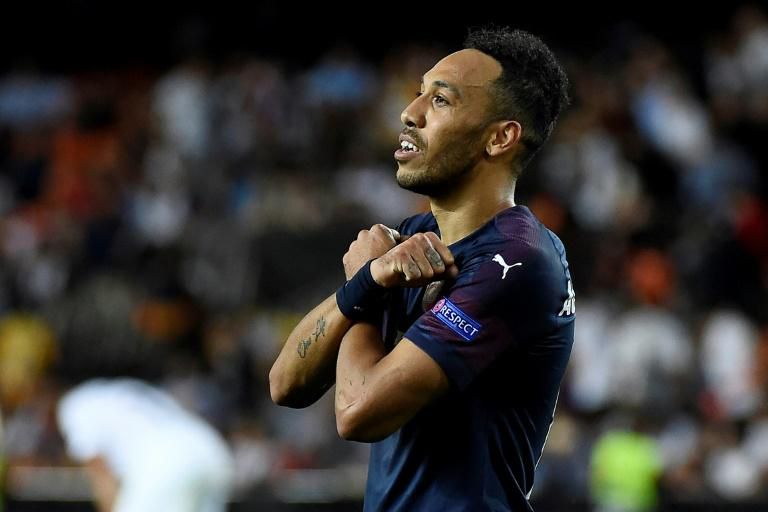 Triple top: Arsenal's Pierre-Emerick Aubameyang celebrates his hat-trick