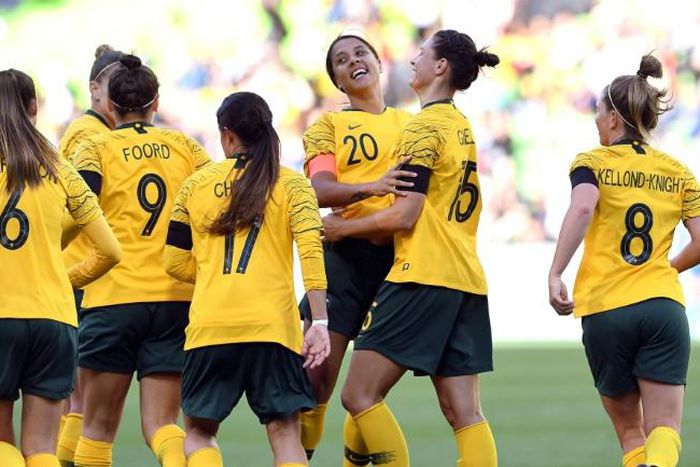 Sam Kerr (C) celebrates with her Australia teammates after scoring against Argentina during the Cup of Nations in Melbourne in March