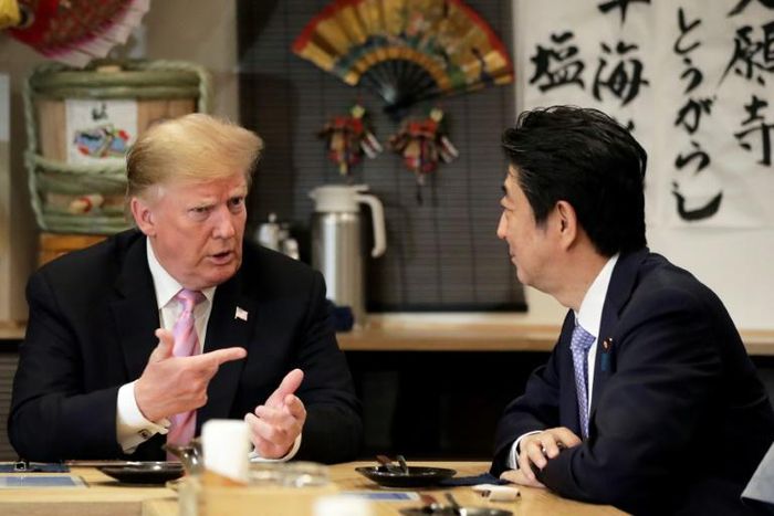 President Trump (L) and Japan's Shinzo Abe dined Sunday at a traditional Japanese grill restaurant, with wagyu beef and vanilla ice cream among the menu items