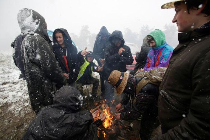 Participants at the Teknival music festival in Feniers, central France, were caught off guard by a spring snowstorm on Saturday, May 4