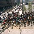 South Africans queue to cast their votes in Johannesburg on April 27, 1994, in the country's first all-race elections