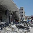 The Palestinian band Dawaween performs on May 14, 2019 on the rubble of a building in the Gaza Strip that was recently destroyed by Israeli air strikes during an event calling for a boycott of the Eurovision song contest hosted by Israel