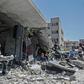 The Palestinian band Dawaween performs on May 14, 2019 on the rubble of a building in the Gaza Strip that was recently destroyed by Israeli air strikes during an event calling for a boycott of the Eurovision song contest hosted by Israel