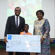 From Left - Sector lead, Union Bank, Emmanuel Essien;  one of the winners of the competition, Quadri Araromi and Director, Greensprings School, Ms. Lai Koiki, at the award ceremony.