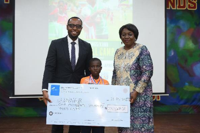 From Left - Sector lead, Union Bank, Emmanuel Essien;  one of the winners of the competition, Quadri Araromi and Director, Greensprings School, Ms. Lai Koiki, at the award ceremony.