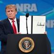 US President Donald Trump shows a signed order rejecting the UN Arms Trade Treaty at the Annual National Rifle Association convention
