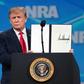 US President Donald Trump shows a signed order rejecting the UN Arms Trade Treaty at the Annual National Rifle Association convention