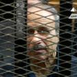 Former Egyptian interior minister Habib al-Adly is seen behind bars during a trial in Cairo in 2013, in an image grab from state TV