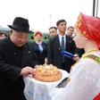 Kim was greeted by women in folk costumes with bread and salt in a traditional greeting