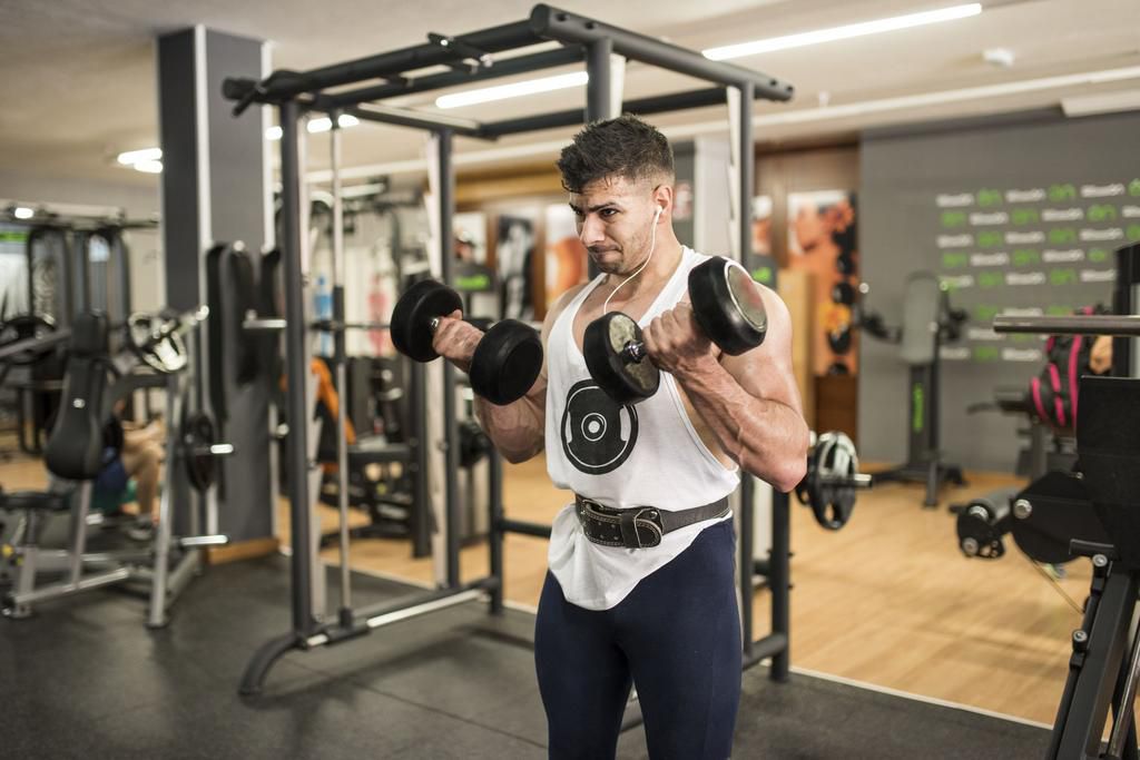 Man lifting weights in gym