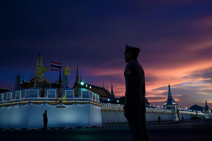 Police stand guard near the Grand Palace in Bangkok ahead of the coronation of Thailand's King Maha Vajiralongkorn