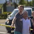 People embrace on April 27, 2019 outside the synagogue in Poway, California, where a gunman opened fire earlier, killing a woman and wounding three people