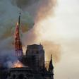 The Notre Dame spire succumbs to the flames on April 15