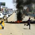 Sudanese demonstrators set fire to tyres to block a Khartoum road as the five-month protests show no signs of abating