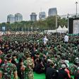 Indonesian police and military personnel gather to break the Ramadan fast with Indonesia's President Joko Widodo in Jakarta on May 16, 2019. Authorities say they have arrested dozens of terror suspects ahead of the forthcoming election result announcem...