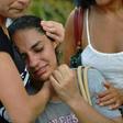 A woman is comforted after two buildings collapsed in the Muzema favela of Rio de Janeiro, Brazil, on April 12, 2019