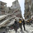 Members of the "White Helmets" rescue group search the rubble of a collapsed building after a previous strike in Idlib's Jisr al-Shughur on Wednesday