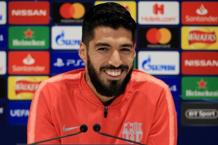 Smiling assassin: Luis Suarez is looking to knock old club Liverpool out of the Champions League