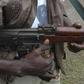 Photo of a gunman wirlding an AK 47 riffle (Pools Online)