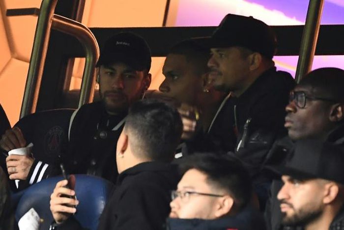 Neymar (left) watched PSG's March 6 defeat to Manchester United from the stands