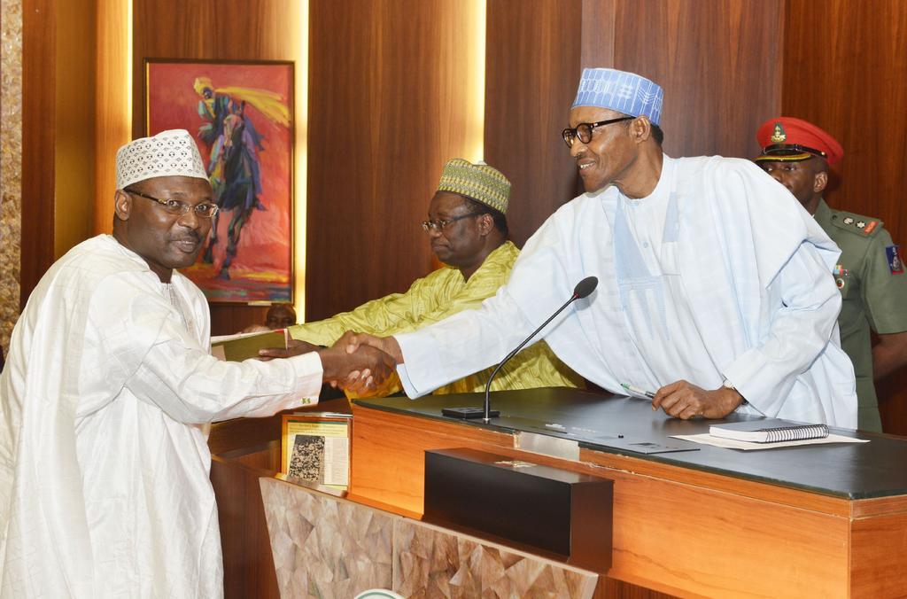 President Muhammadu Buhari and INEC Chairman Prof. Mahmood Yakubu [Africa24hrs]