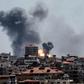 Smoke billows over Gaza City after Israel carries out an air strike in response to a barrage of rockets fired by Palestinian militants
