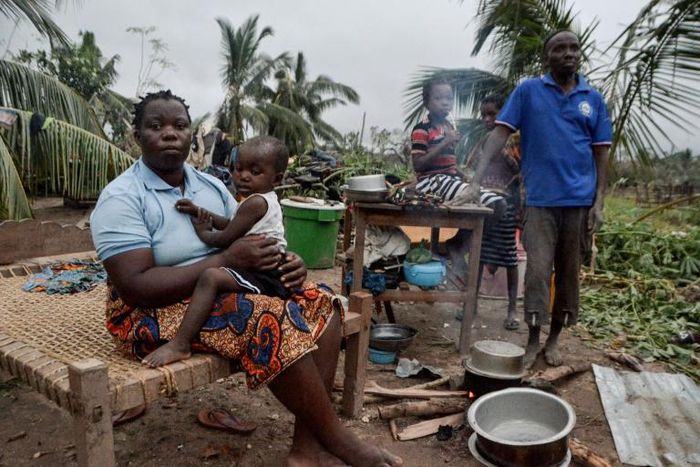 Maria Mendosa, Assan Madal and their children are among those without shelter in the village of Nacate, south of Macomia