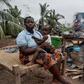 Maria Mendosa, Assan Madal and their children are among those without shelter in the village of Nacate, south of Macomia