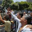 National Guard members who joined Venezuela's self-proclaimed acting president Juan Guaido in his campaign to oust President Nicolas Maduro, are greeted by opposition supporters in Caracas on April 30, 2019